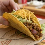 Close-up of Taco Bell's Double Decker Taco showcasing its crunchy shell wrapped in a soft tortilla with fresh lettuce, cheese, and seasoned beef.