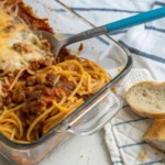 Golden, cheesy spaghetti casserole fresh out of the oven