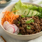 Ground beef bulgogi served with rice and sesame seeds